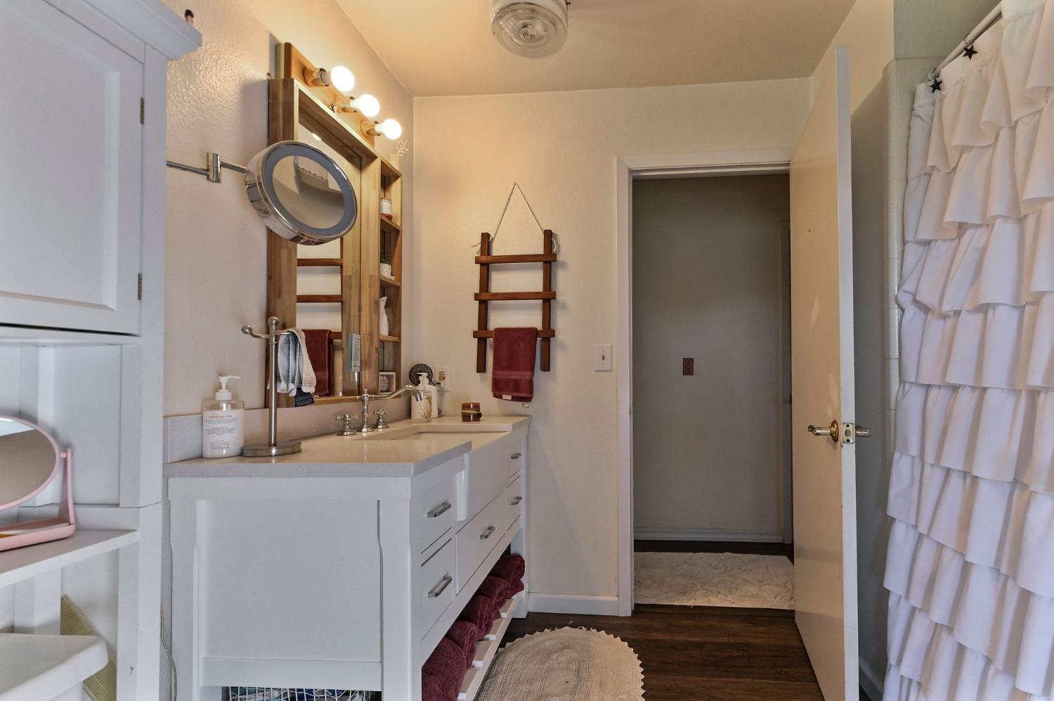 3653 Chuckwagon Drive Copperopolis, CA 95228 - Photo 30 of 73 a bathroom with a sink a mirror and a shower