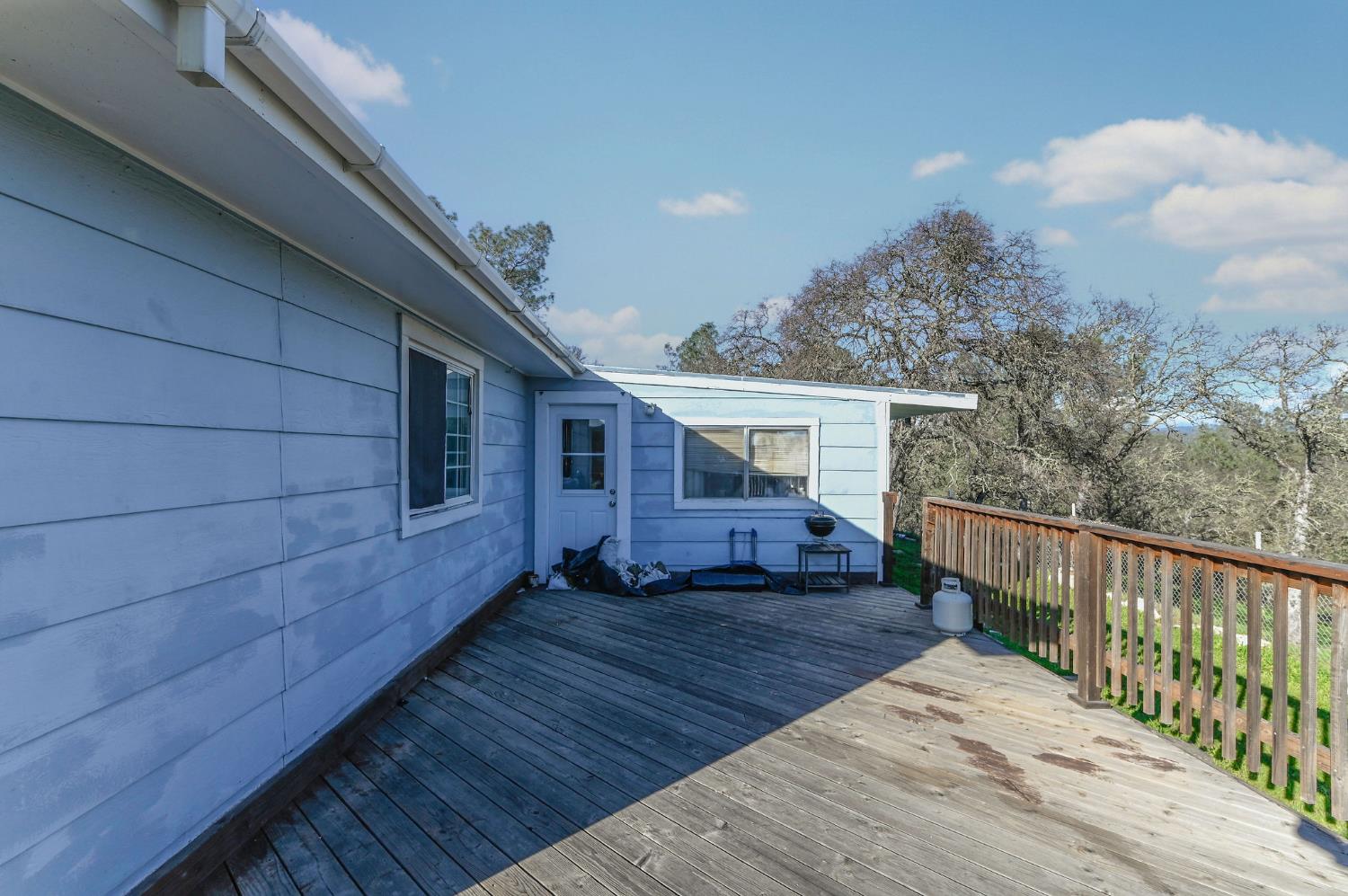 3653 Chuckwagon Drive Copperopolis, CA 95228 - Photo 39 of 73 a view of house with backyard and wooden floor