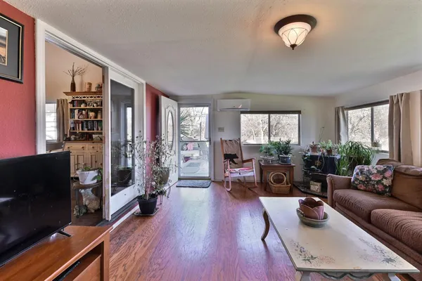 a kitchen with stainless steel appliances kitchen island granite countertop a sink and cabinets