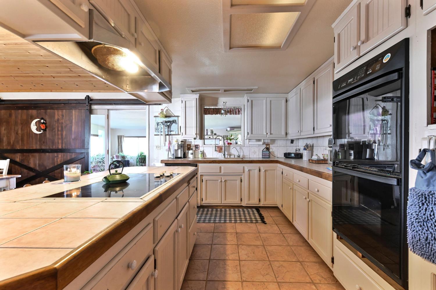3653 Chuckwagon Drive Copperopolis, CA 95228 - Photo 8 of 73 a kitchen with a sink cabinets and window