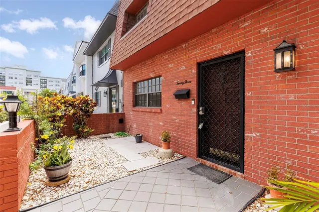 a view of a chairs and table in the patio
