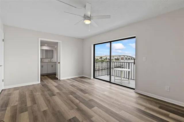 a view of a room with cabinet and wooden floor