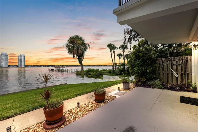 a front view of a house with outdoor seating