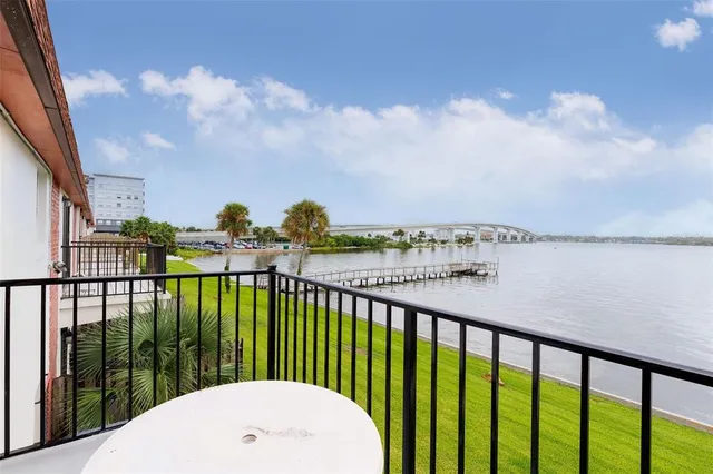 a view of a lake with houses in the back