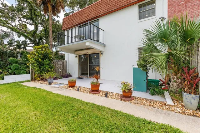 a view of swimming pool with outdoor seating and city view