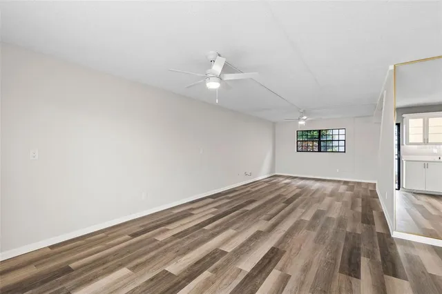 a view of a kitchen with microwave and cabinets