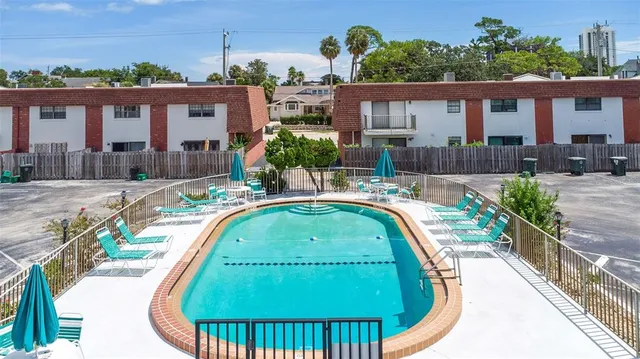 an aerial view of multiple house with yard