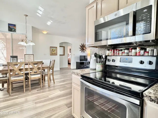a dining room with furniture and window