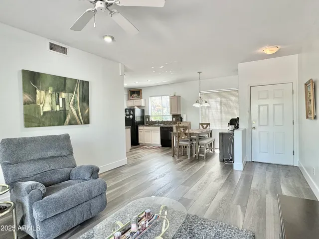 a bedroom with a bed couch and window