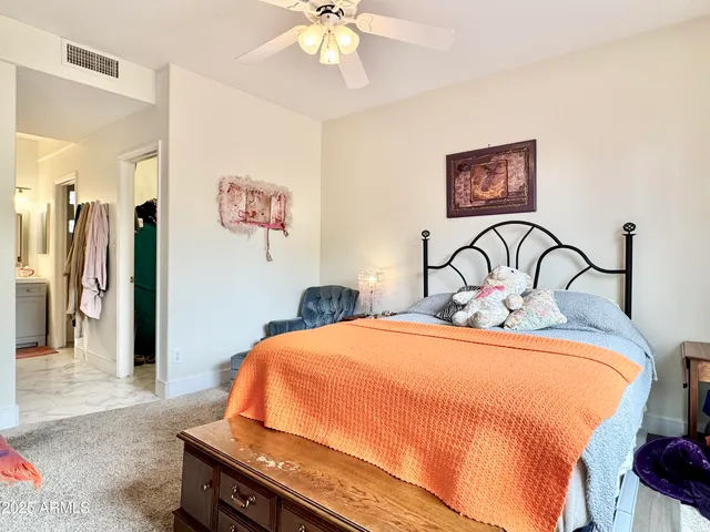 a utility room with cabinets dryer and washer
