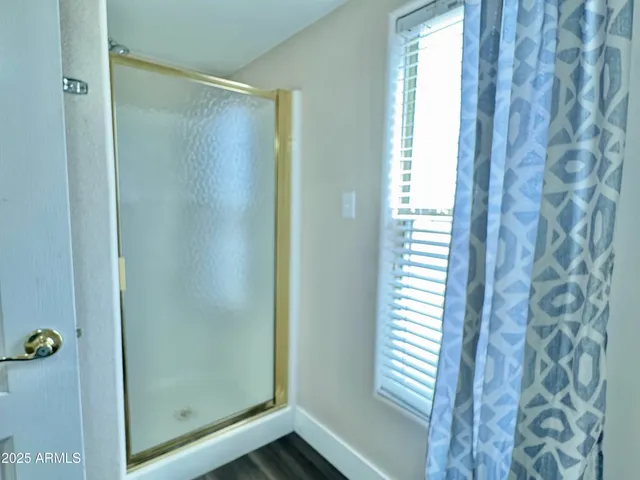 a bedroom with a bed and lamp