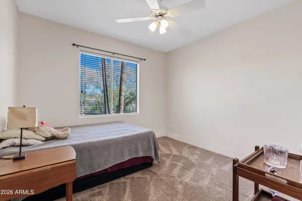 a bedroom with a bed and window