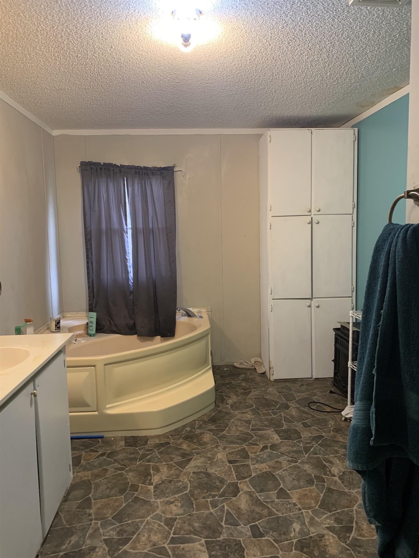 6681 Lightfoot Luckett Road Ripley, TN 38063 - Photo 15 of 17 a bathroom with a bathtub and a sink