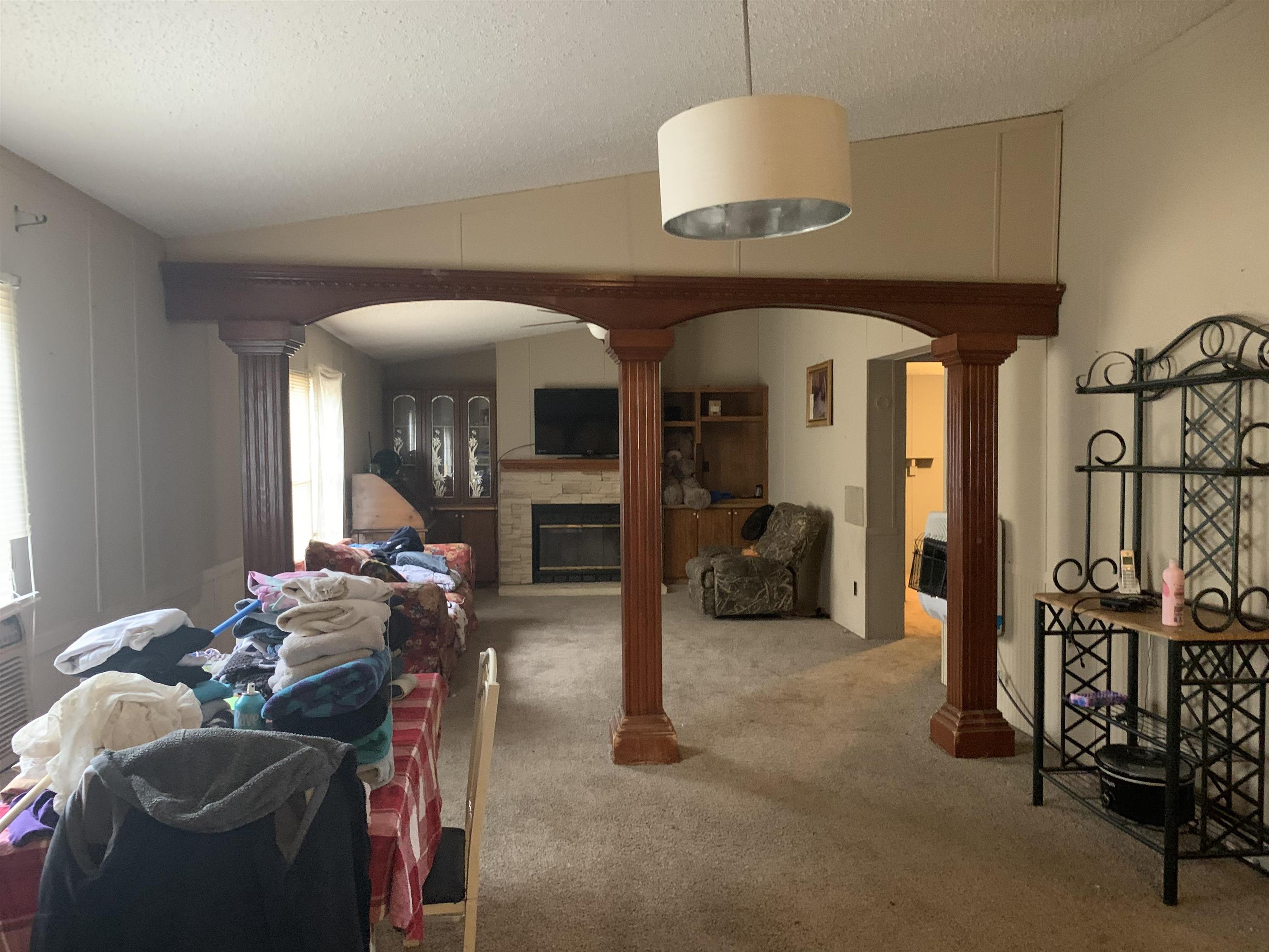 6681 Lightfoot Luckett Road Ripley, TN 38063 - Photo 8 of 17 a living room with furniture a fireplace and white walls