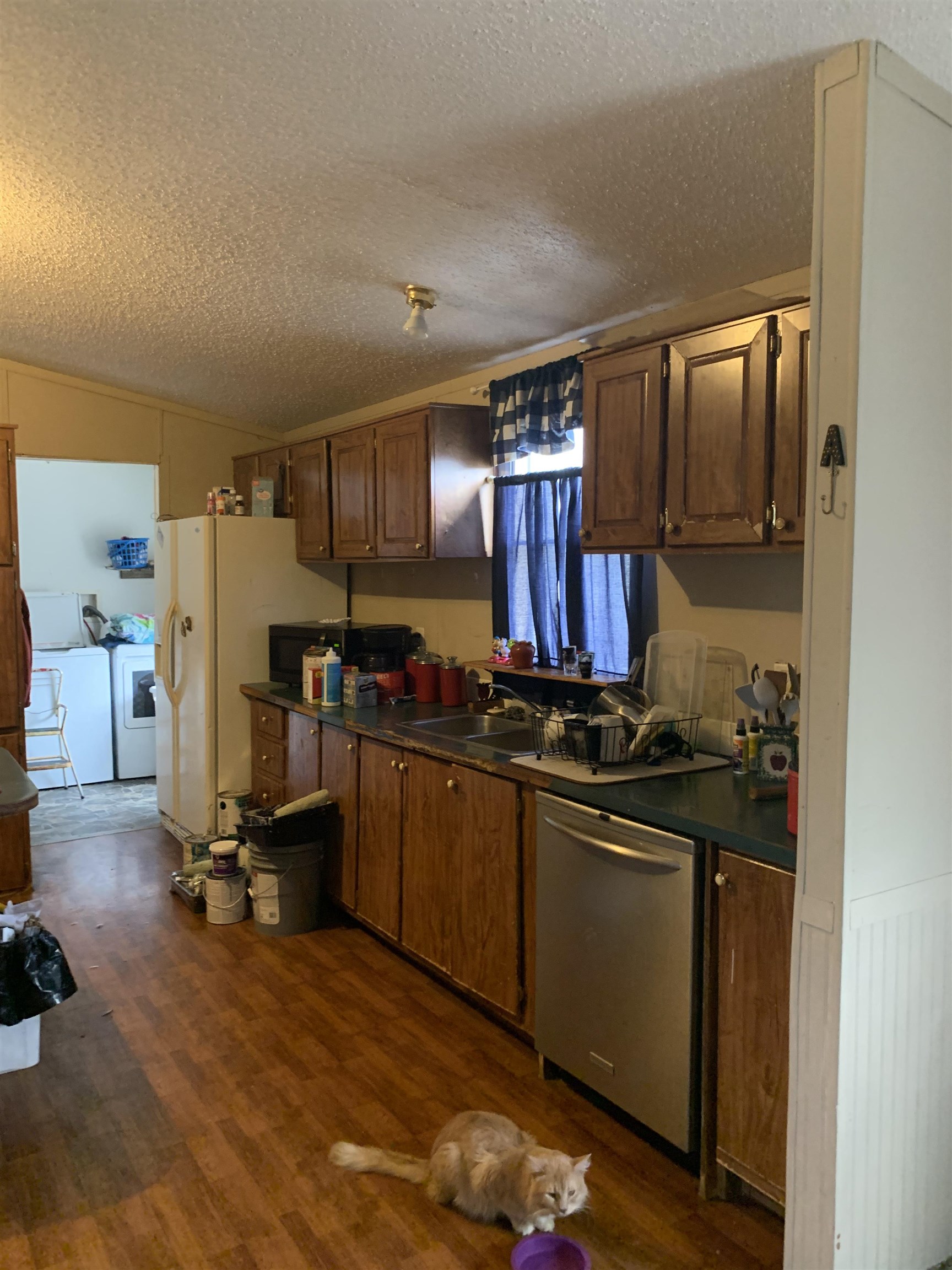 6681 Lightfoot Luckett Road Ripley, TN 38063 - Photo 9 of 17 a view of a kitchen with refrigerator and wooden floor