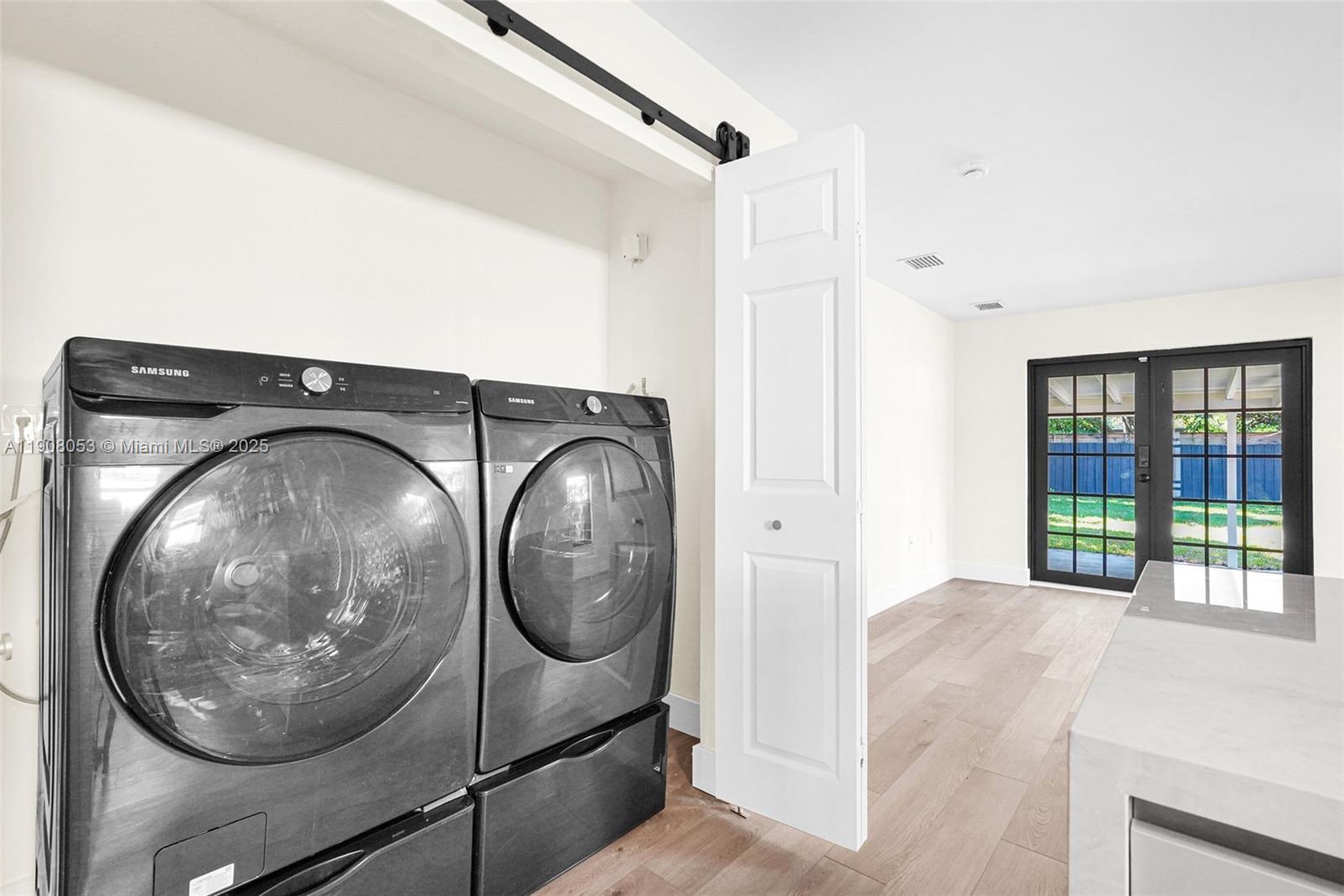 136 Northwest 53rd Street Miami, FL 33127 - Photo 12 of 28 a view of a hallway with washer and dryer