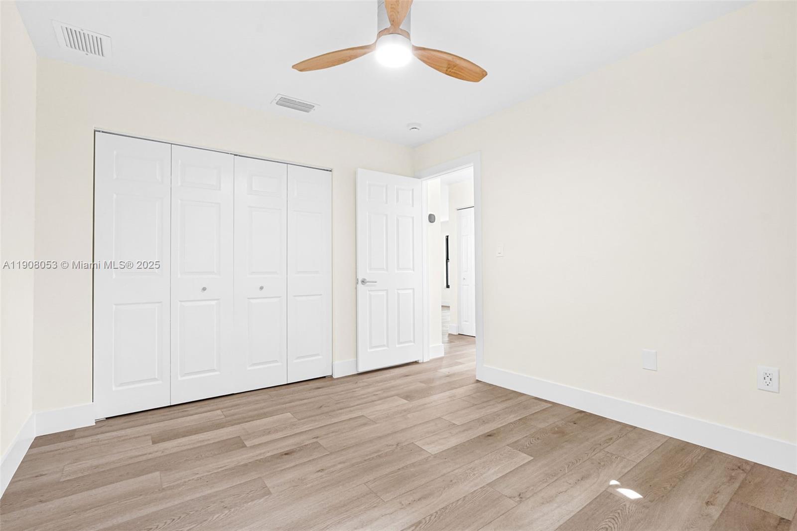 136 Northwest 53rd Street Miami, FL 33127 - Photo 19 of 28 a view of an empty room with wooden floor