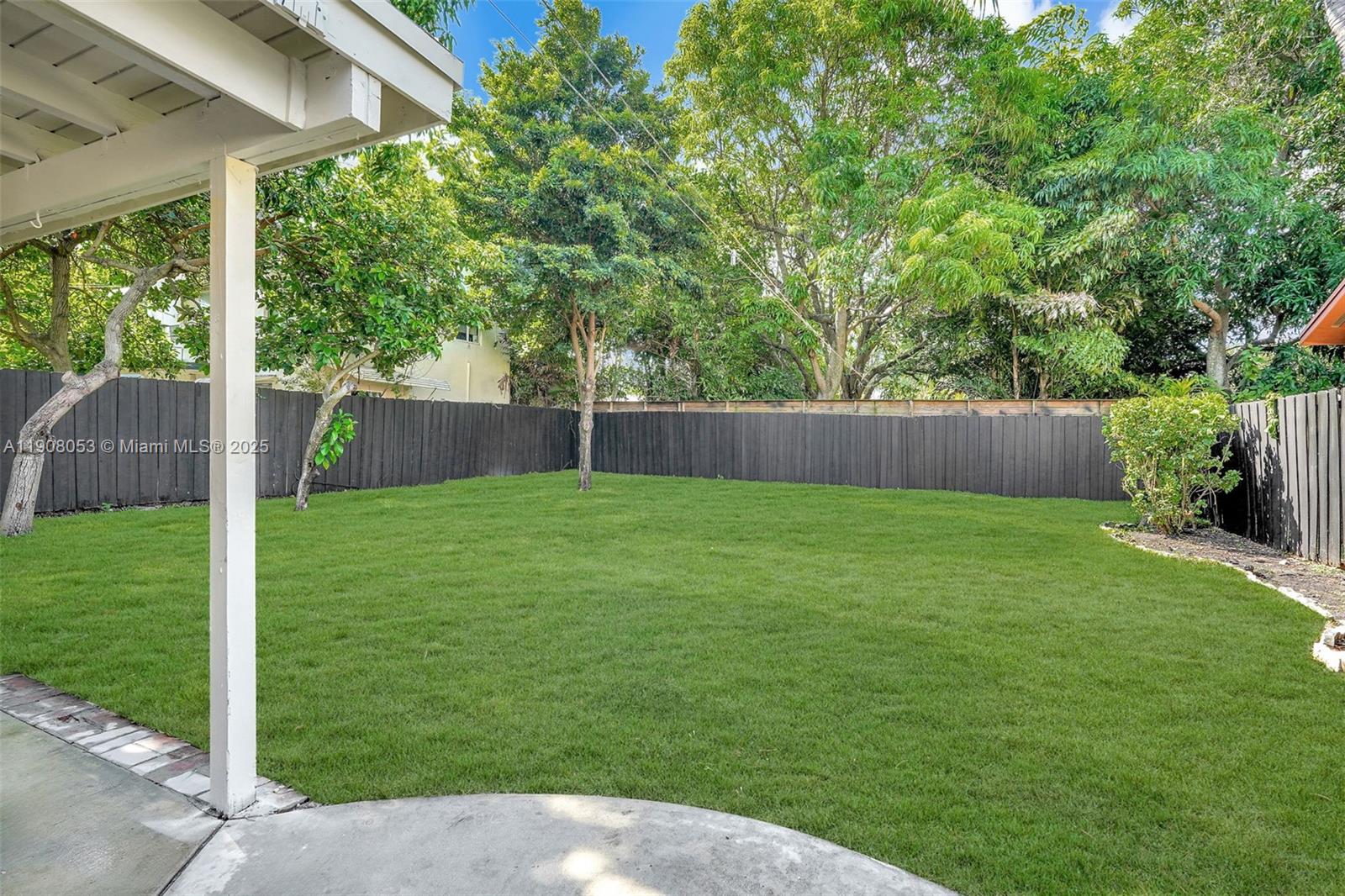 136 Northwest 53rd Street Miami, FL 33127 - Photo 25 of 28 a backyard of a house with lots of green space