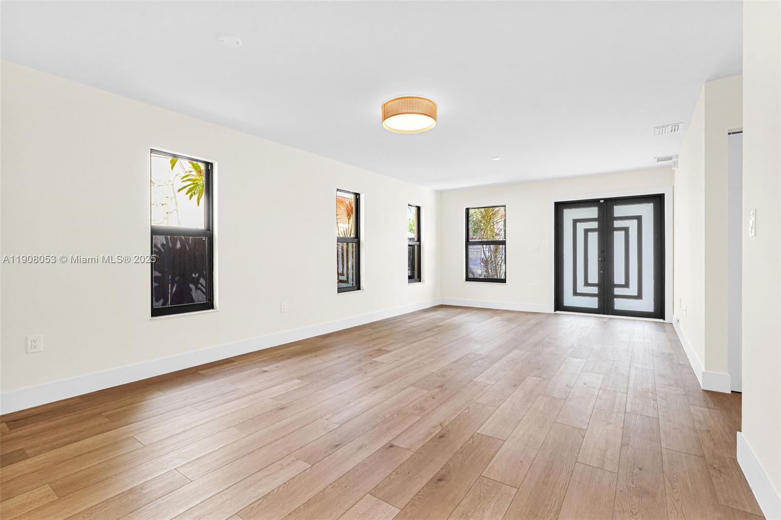 136 Northwest 53rd Street Miami, FL 33127 - Photo 5 of 28 a view of an empty room and window