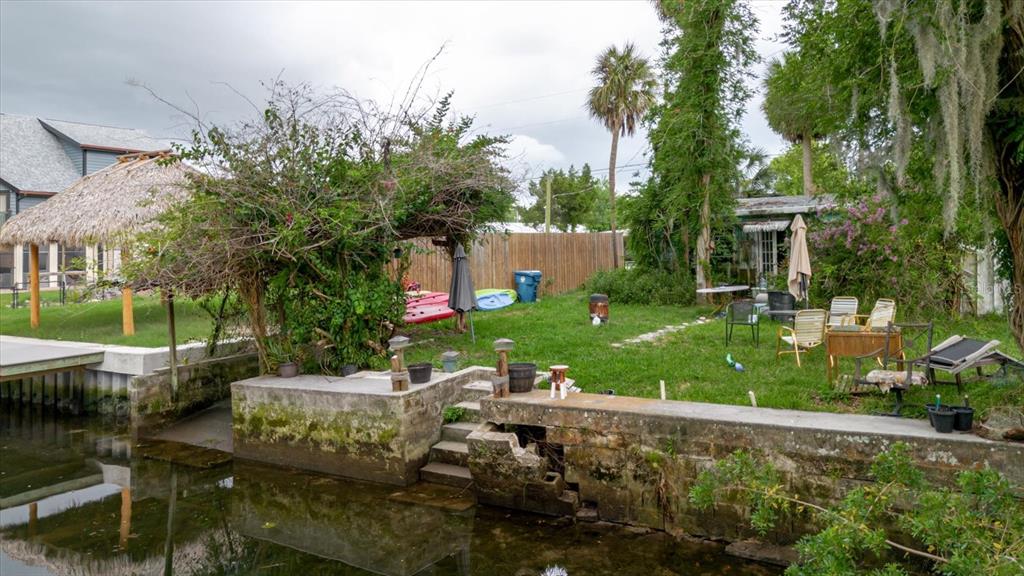 5323 Circle Drive Weeki Wachee, FL 34607 - Photo 2 of 77 a view of backyard with outdoor seating and plants