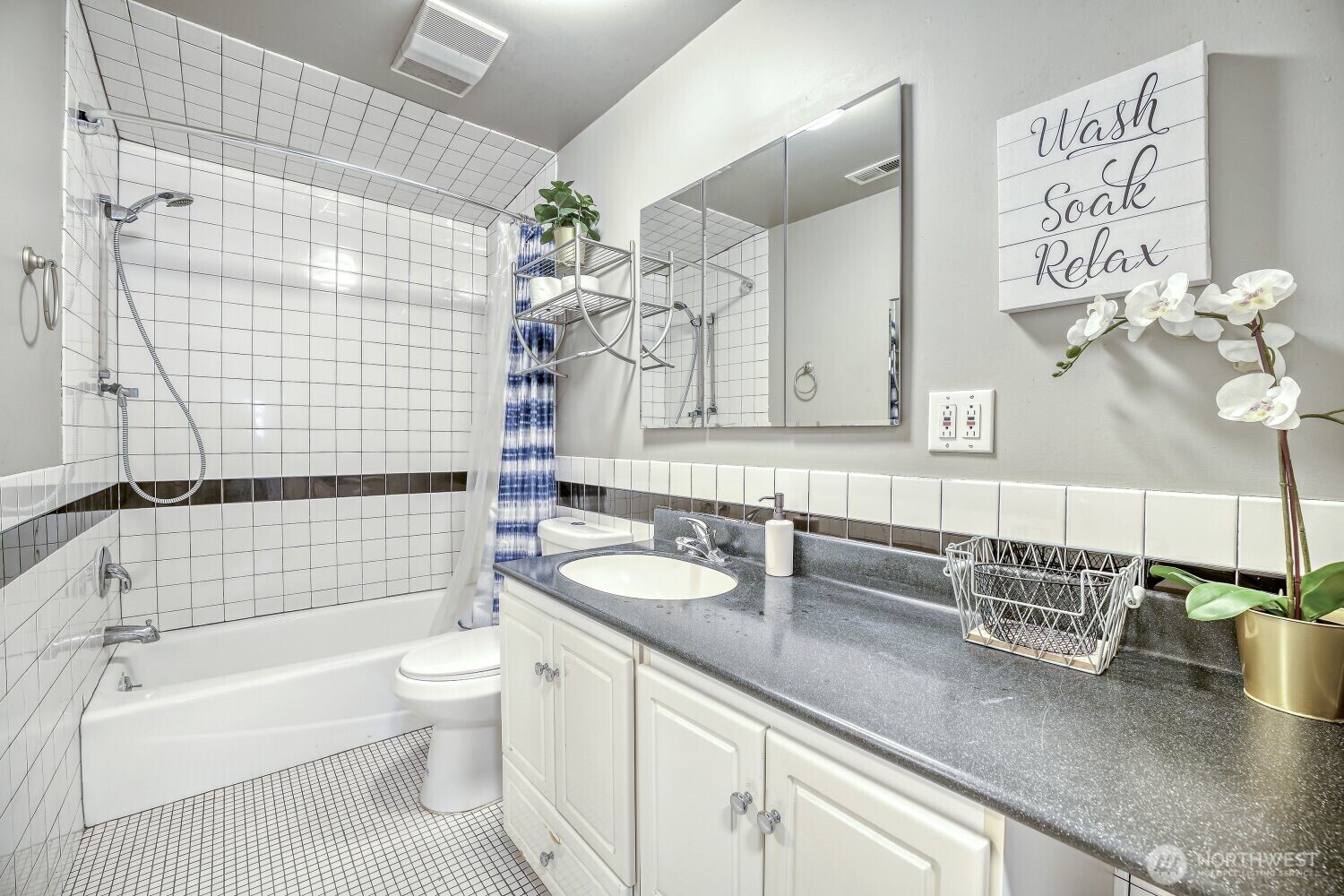 1401 Lake Youngs Way Southeast Renton, WA 98058 - Photo 14 of 27 a bathroom with a granite countertop bathtub sink vanity mirror and toilet