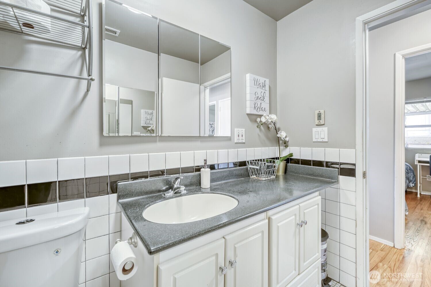 1401 Lake Youngs Way Southeast Renton, WA 98058 - Photo 15 of 27 a bathroom with a sink and a mirror