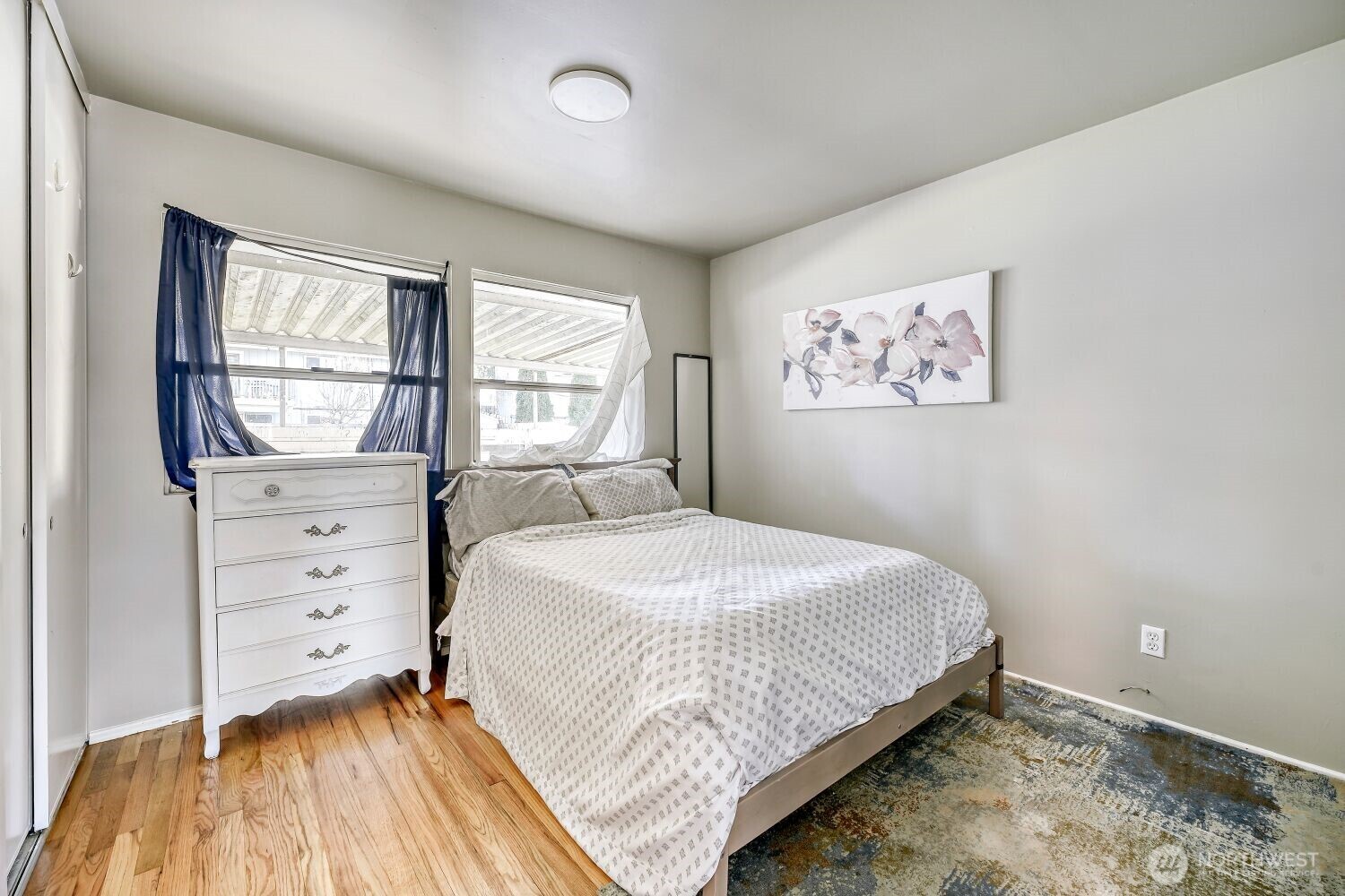 1401 Lake Youngs Way Southeast Renton, WA 98058 - Photo 16 of 27 a bedroom with a bed and a window