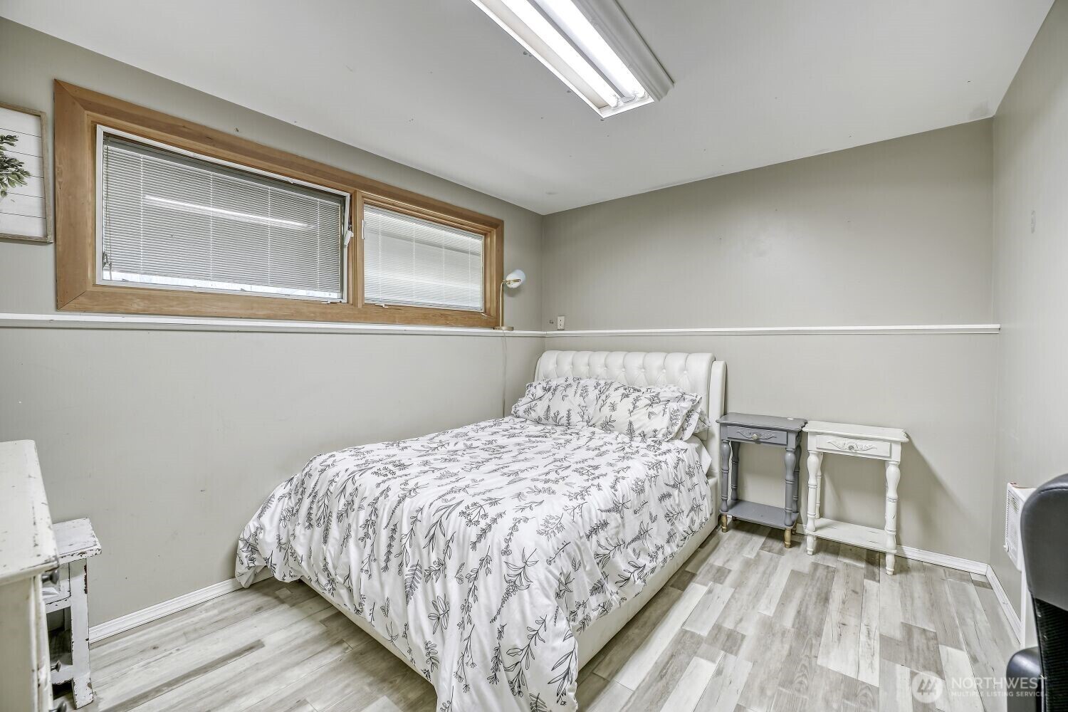 1401 Lake Youngs Way Southeast Renton, WA 98058 - Photo 19 of 27 a bed sitting in a bedroom next to a window