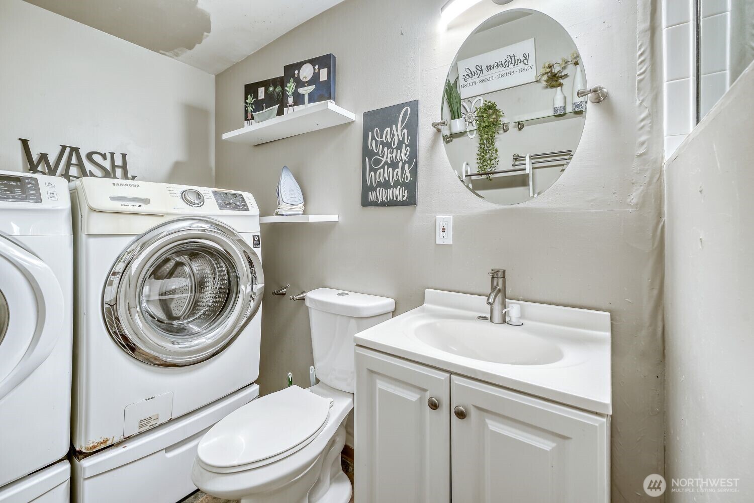 1401 Lake Youngs Way Southeast Renton, WA 98058 - Photo 22 of 27 a white toilet sitting next to a bathroom sink