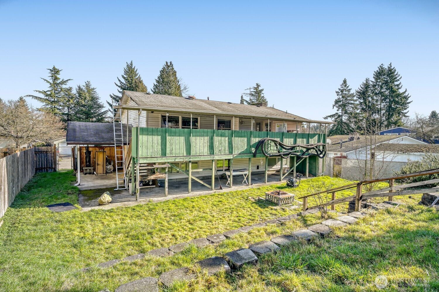 1401 Lake Youngs Way Southeast Renton, WA 98058 - Photo 26 of 27 a view of a house with pool and chairs