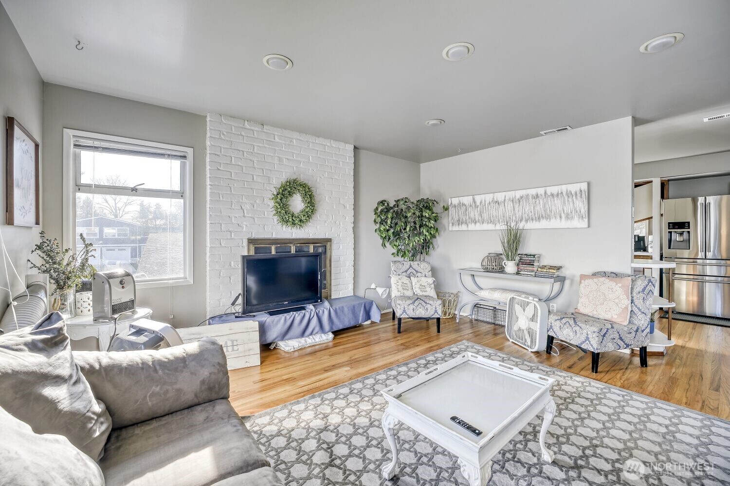 1401 Lake Youngs Way Southeast Renton, WA 98058 - Photo 4 of 27 a living room with furniture and a fireplace