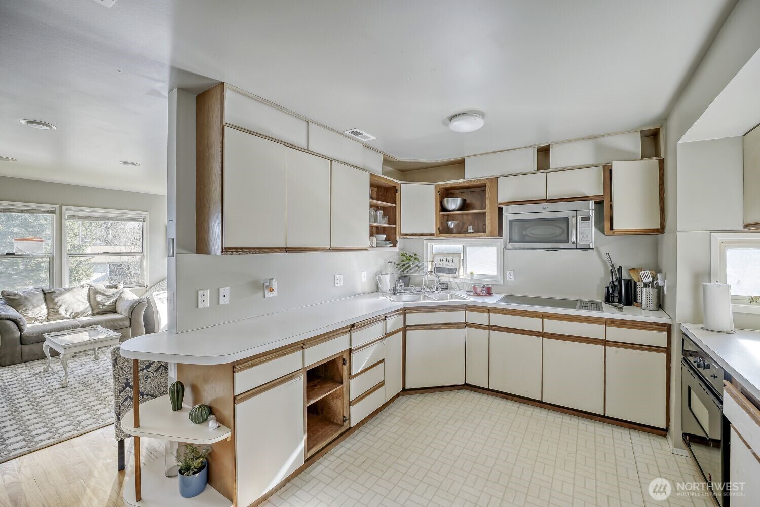 1401 Lake Youngs Way Southeast Renton, WA 98058 - Photo 7 of 27 a kitchen with a sink stove and cabinets