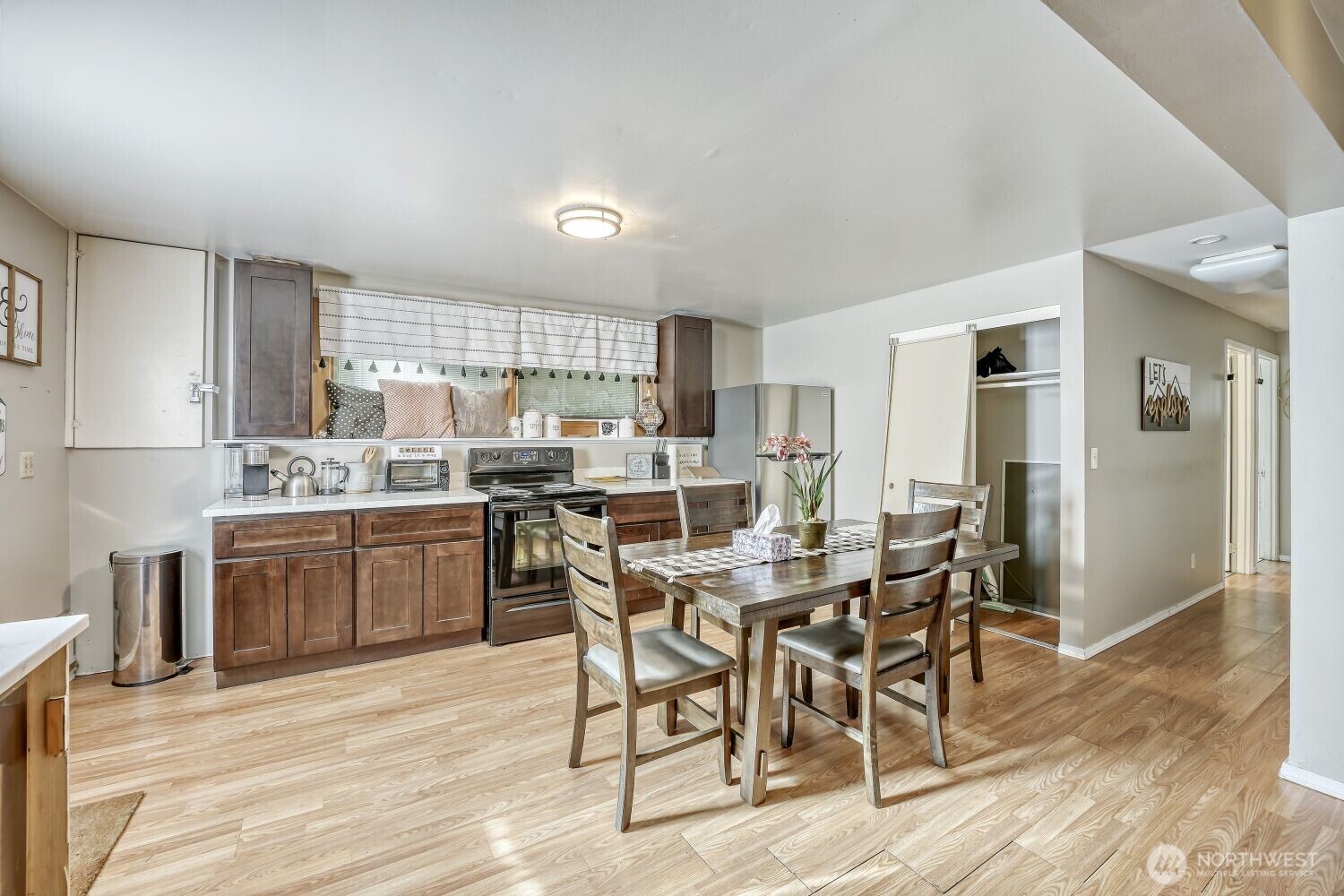1401 Lake Youngs Way Southeast Renton, WA 98058 - Photo 8 of 27 a kitchen with a table and chairs in it