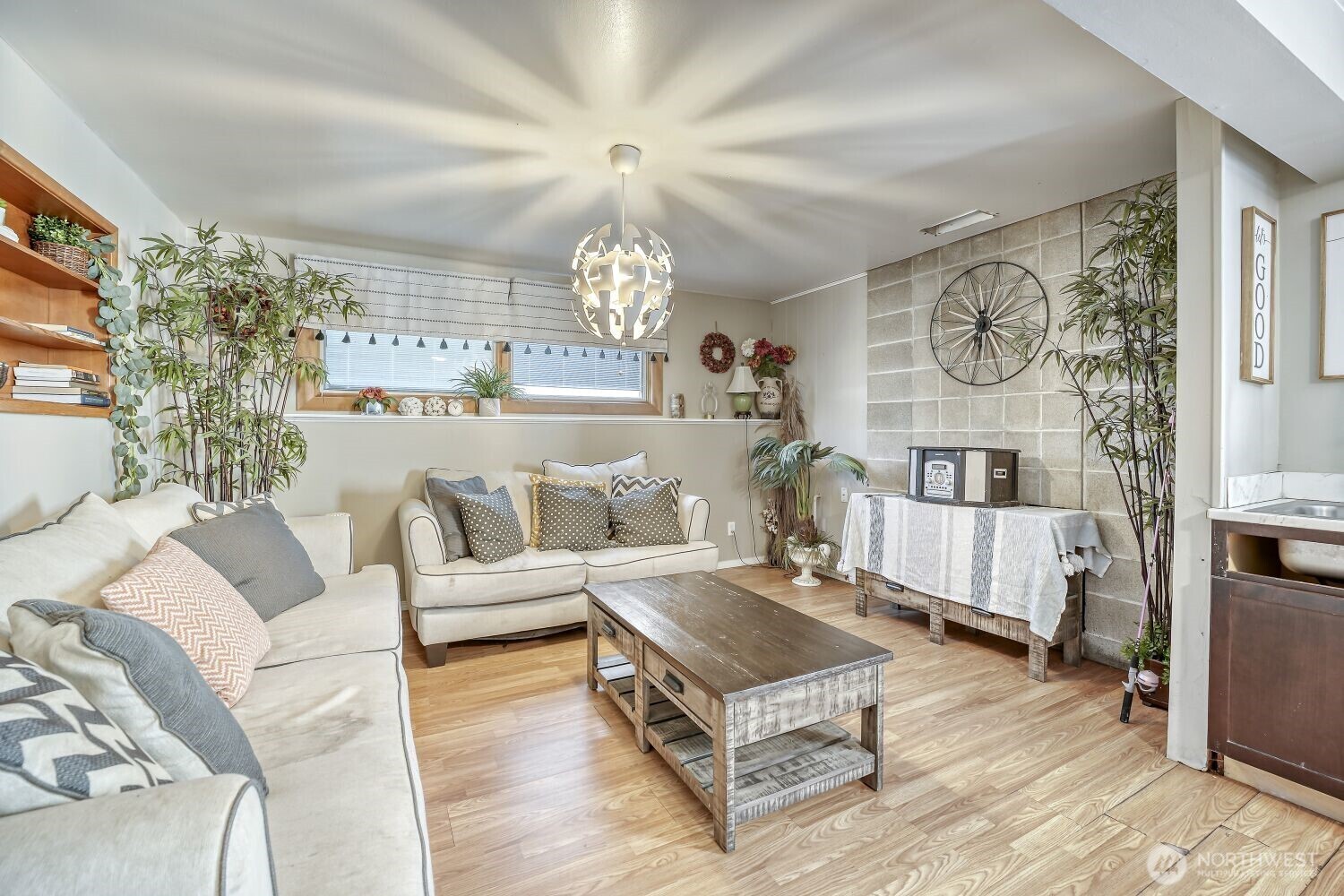 1401 Lake Youngs Way Southeast Renton, WA 98058 - Photo 10 of 27 a living room with furniture and a chandelier