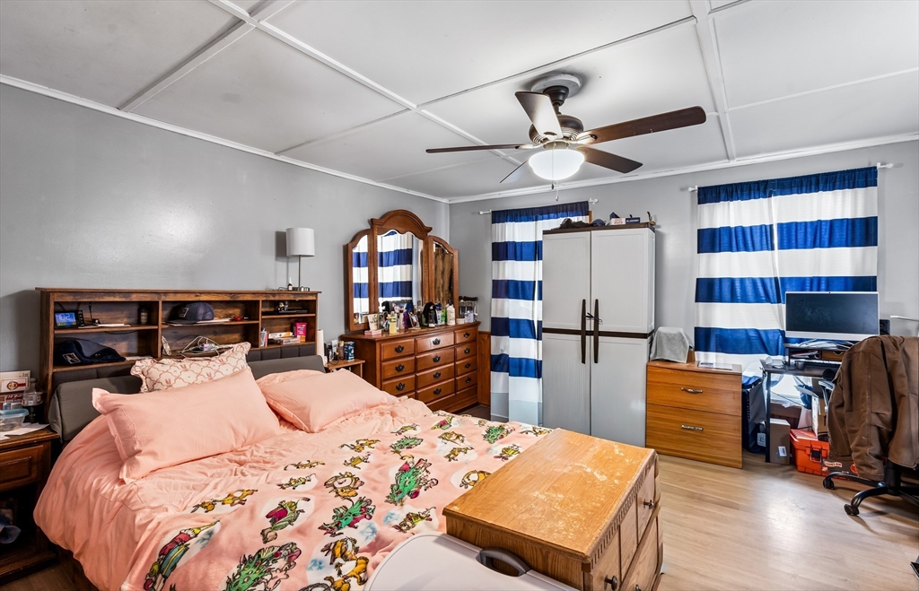 77 Wheeler Street Athol, MA 01331 - Photo 20 of 39 a bedroom with a bed a desk and chair