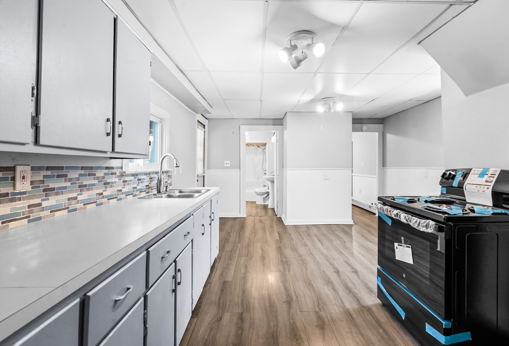 77 Wheeler Street Athol, MA 01331 - Photo 2 of 39 a kitchen with a stove and a sink