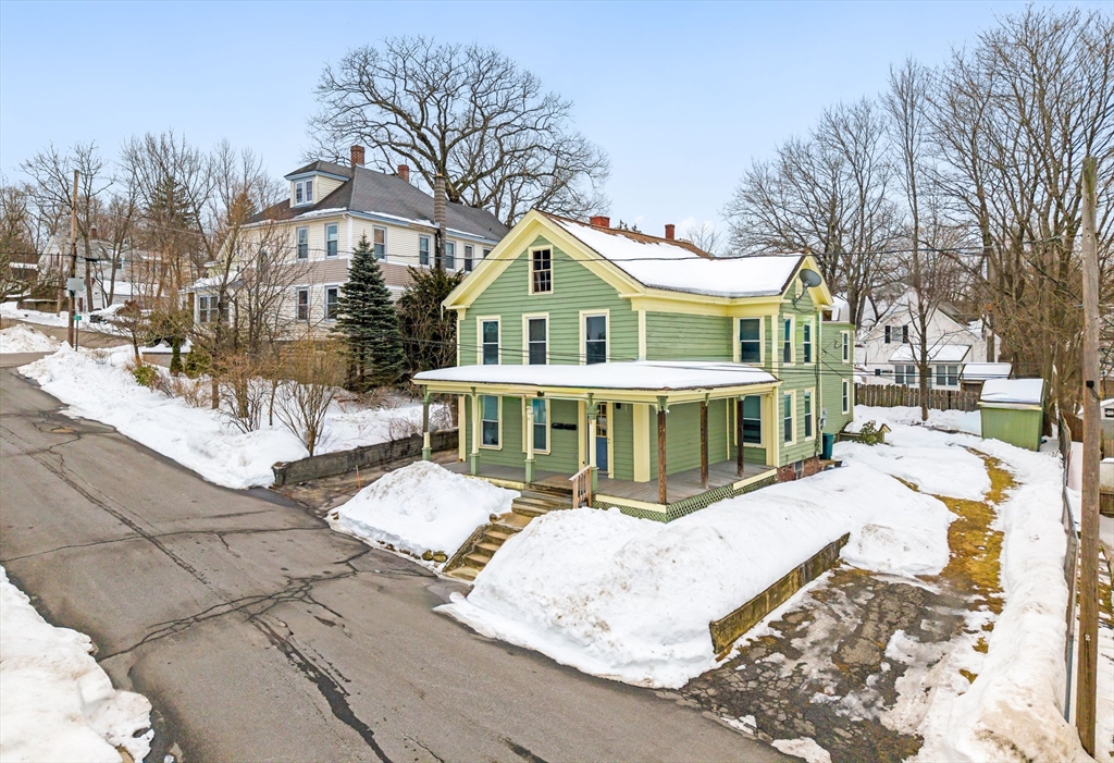 77 Wheeler Street Athol, MA 01331 - Photo 39 of 39 a view of a house with a yard covered with snow in the background
