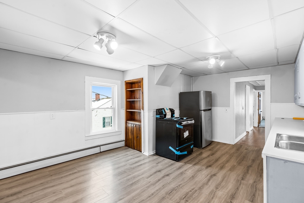 77 Wheeler Street Athol, MA 01331 - Photo 4 of 39 a view of a livingroom with a furniture wooden floor and a window