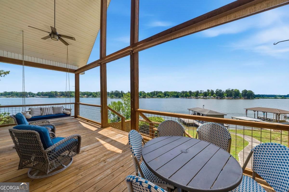172 Mays Road Milledgeville, GA 31061 - Photo 2 of 54 a view of a swimming pool with a couches chairs and city view