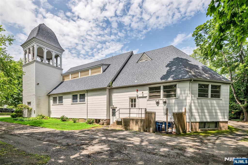283 Harrington Avenue Closter, NJ 07624 - Photo 9 of 17 a view of a house with a yard
