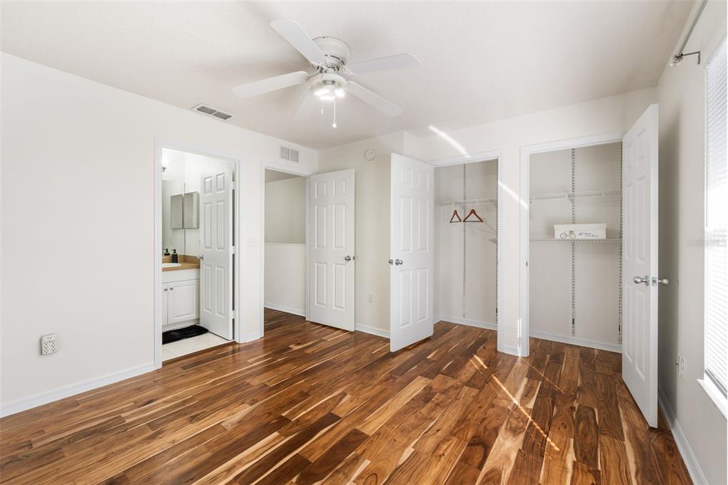 2348 Southwest 42nd Drive, Unit 154 Gainesville, FL 32607 - Photo 11 of 35 a bedroom with a bed and a chandelier