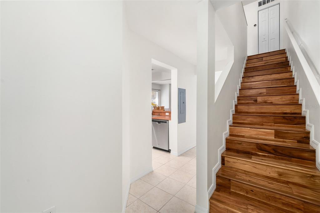 2348 Southwest 42nd Drive, Unit 154 Gainesville, FL 32607 - Photo 17 of 35 a view of a hallway with wooden floor and entryway