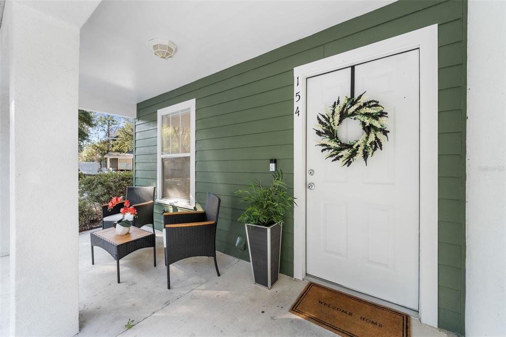 2348 Southwest 42nd Drive, Unit 154 Gainesville, FL 32607 - Photo 2 of 35 a living room with furniture and a potted plant