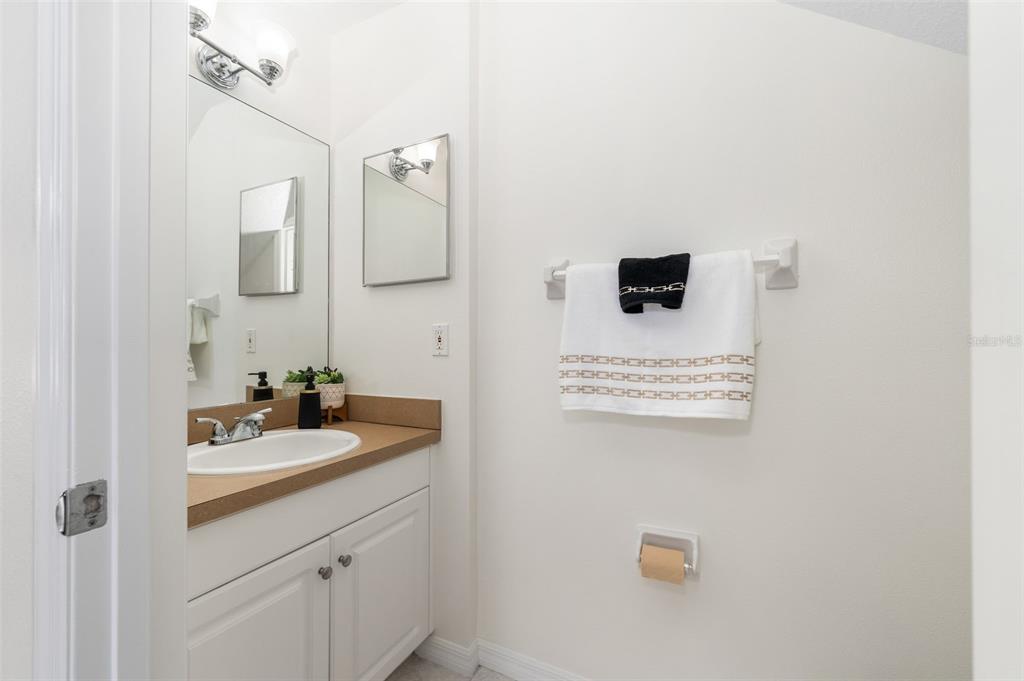 2348 Southwest 42nd Drive, Unit 154 Gainesville, FL 32607 - Photo 23 of 35 a bathroom with a sink and a mirror