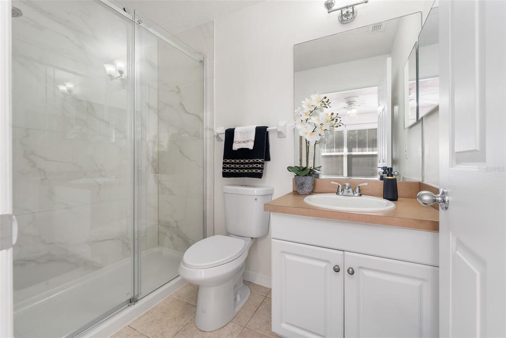 2348 Southwest 42nd Drive, Unit 154 Gainesville, FL 32607 - Photo 4 of 35 a bathroom with a sink a toilet and shower