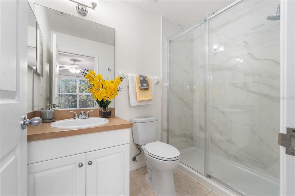 2348 Southwest 42nd Drive, Unit 154 Gainesville, FL 32607 - Photo 8 of 35 a bathroom with a sink toilet and shower
