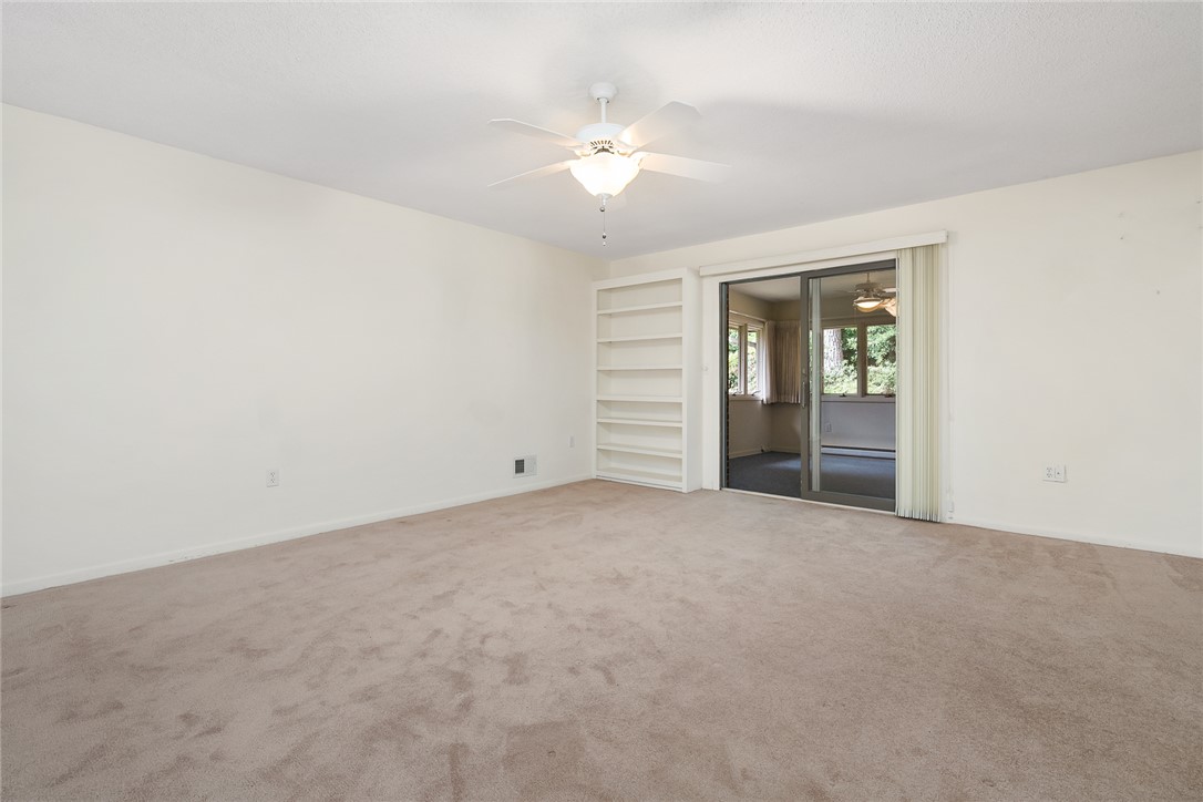 34 Hickory Way Clemson, SC 29631 - Photo 13 of 39 A comfortable primary bedroom offers direct access to an adjoining sunroom, perfect for relaxation.