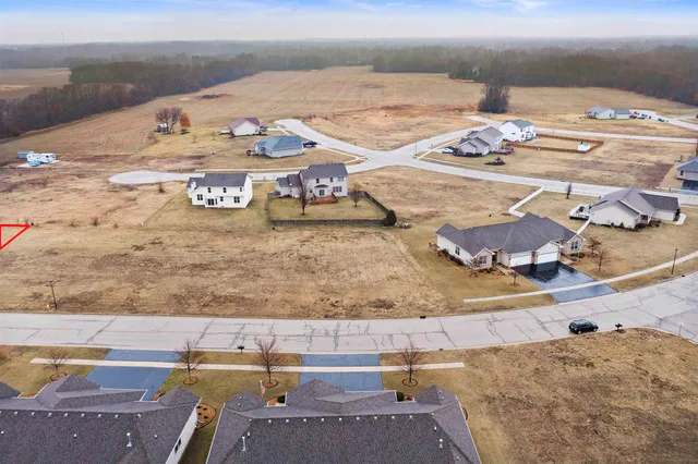 an aerial view of a house with outdoor space