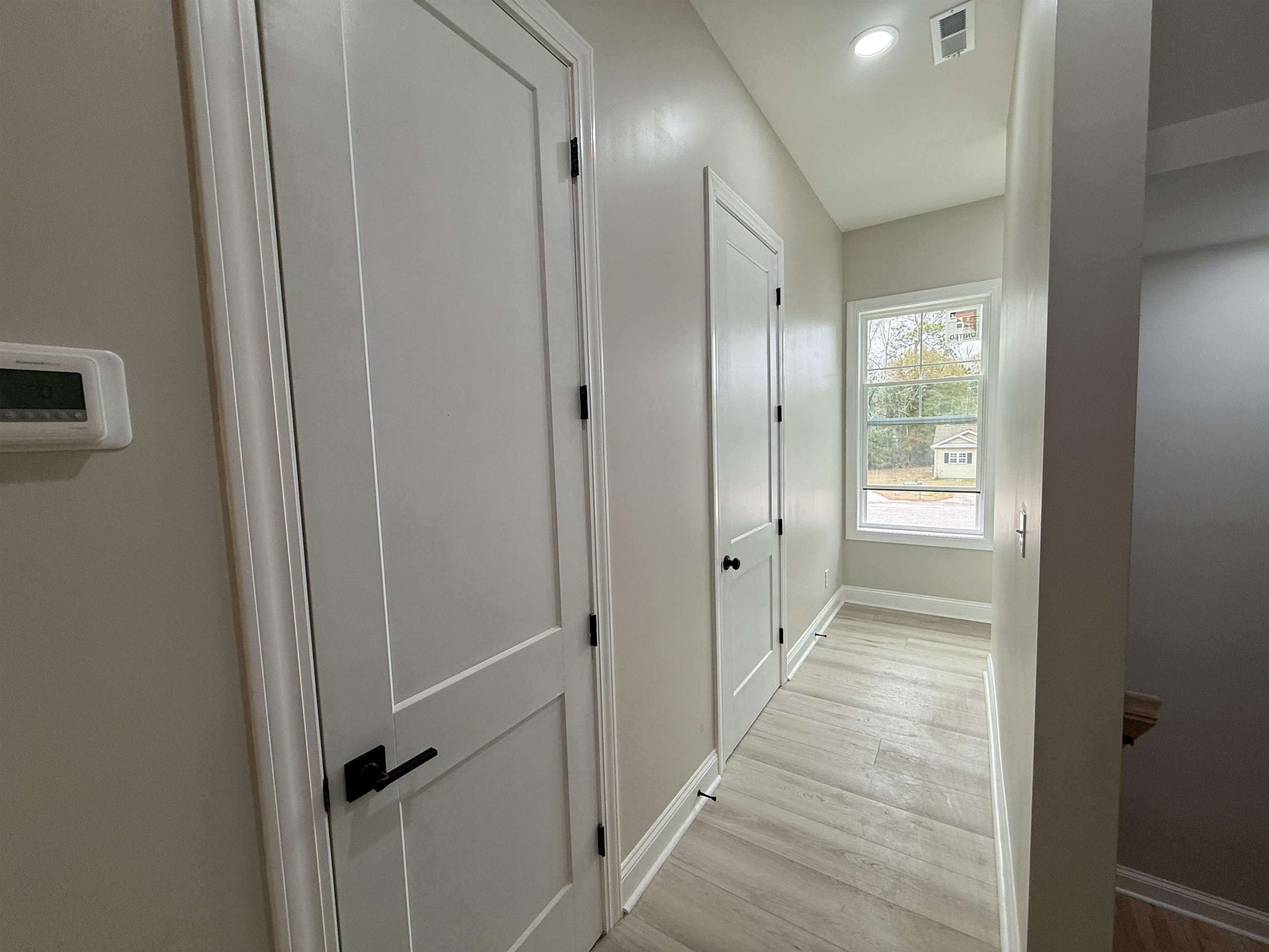 191 Carlisle Way Myrtle Beach, SC 29579 - Photo 18 of 40 These doors lead to half bath & Laundry Room.