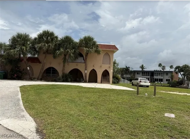 a view of a garden with a bench in a patio